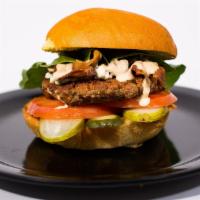 Black & Bleu Burger · Cajun seasoned burger, bleu cheese crumbles, bacon, pickles, and court side sauce. Served on...