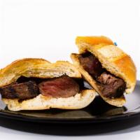 London Broil Sandwich · Thinly sliced marinated flank steak, grilled to order and served on a butter toasted sub rol...