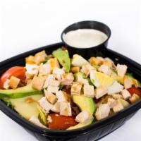 Chicken Cobb Salad · Grilled chicken breast, freshly sliced avocado, crispy bacon, tomatoes, egg and Swiss. Serve...