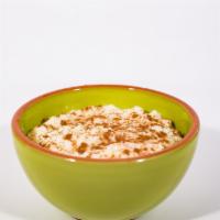 Rice Pudding · Classic rice pudding topped with cinnamon.