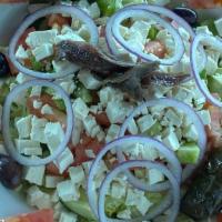 Greek Salad · Lettuce, feta cheese, tomato, cucumber, green peppers, black olives, anchovies, and grape le...