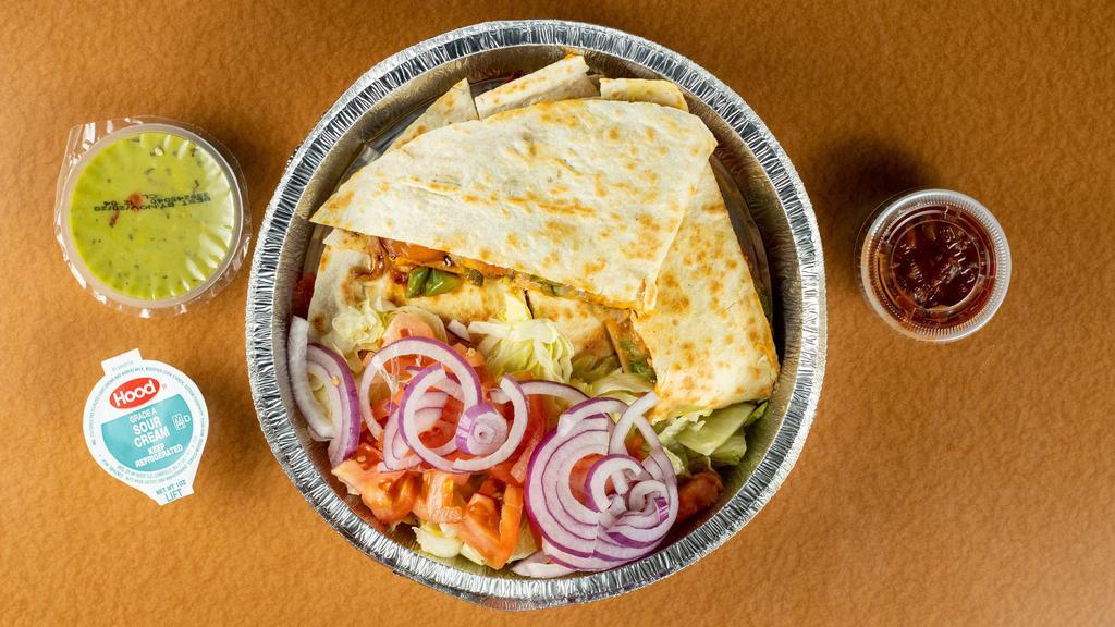 Chicken Quesadilla · Grilled chicken, sauté peppers, onions, tomatoes, jalapeño peppers and cheddar cheese with salsa, sour cream and guacamole.