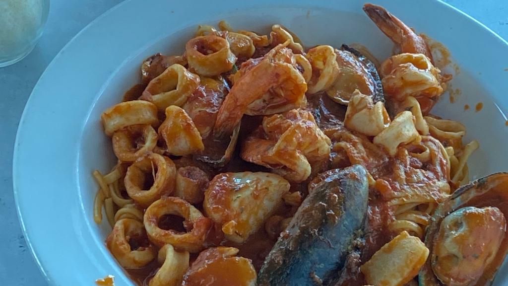 Seafood Fra Diavolo · With sautéed shrimp, scallops. Calamari and mussels in a spicy tomato sauce over linguini.