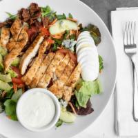 The Cobb Salad · Grilled chicken, avocado, hard boiled egg, bacon, and blue cheese over a garden salad.