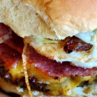 Yous Guys · American cheese, grilled pork roll, fried egg, topped with shredded iceberg lettuce and cara...