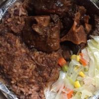 Oxtail · A Caribbean favorite braised in its own natural gravy with onions, peppers, butter beans, an...