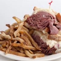 Reuben · Corned beef on rye, sauerkraut, topped with swiss cheese and then grilled.