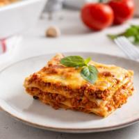 Lasagna · Tender layers of pasta filled with hearty meat and savory marinara sauce and served with sid...