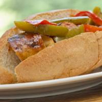 Sausage & Peppers Hero · Served with crisp lettuce between a hot toasty hero.