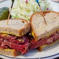 Pastrami Melt · Flavorful pastrami, sauteed onions, muenster cheese & chipotle sauce on toasted garlic hero ...