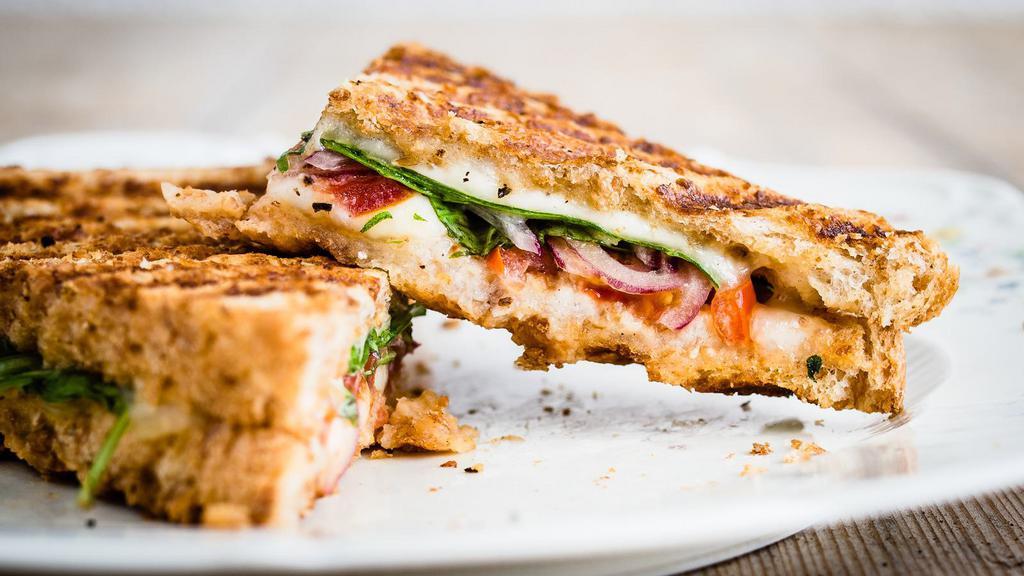 Italian Ciao Bella Toasty · Prosciutto, pepperoni, salami, fresh mozzarella cheese, basil, and tomatoes on a toasted hero with beverage of choice.