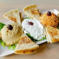 Three Dip Combo · includes, hummus, tirokafteri, and tzatziki dips with pita bread