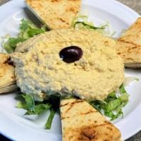 Hummus · creamy seasoned chick peas, olive oil, lemon, and garlic dip served with pita bread. *VEGETA...