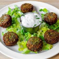 Falafel Appetizer · pan fried croquettes of ground chickpeas, onion, and  herbs served with tzatziki. *GF* *VEGE...