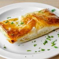 Spanakopita Appetizer · spinach and feta cheese wedged between layers of phyllo pastry and baked to a golden brown. ...