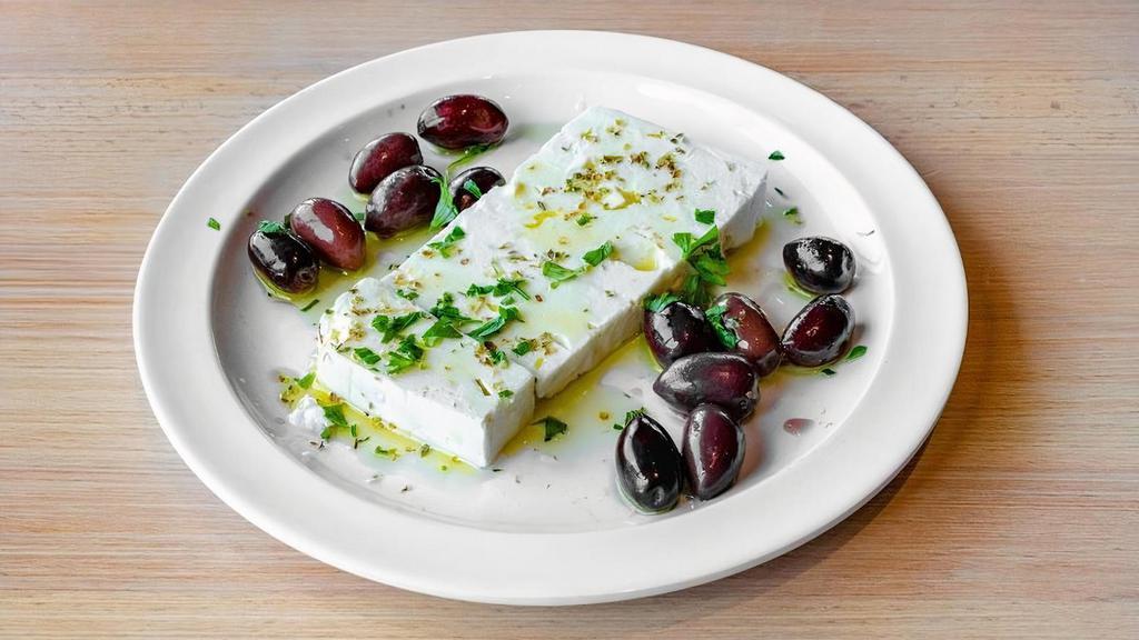 Feta And Olives · Thick Sliced Feta cheese served with black kalamata olives and a drizzle of olive oil. *GF* *VEGETARIAN*