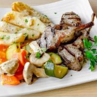 Lamb Chops · (4) lamb chops served with potato, mixed vegetables, greek salad and a pita