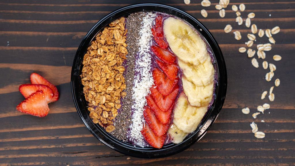 The Amazing Açaí Bowl · 530 cal mixed berries & açaí blended with yogurt & topped with banana, coconut, cacao nibs, berry coconut granola, almond butter, chia seeds & a drizzle of honey