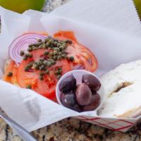Bagel With Nova Lox · Nova lox & cream cheese served with tomato, red onion, capers & kalamata olives