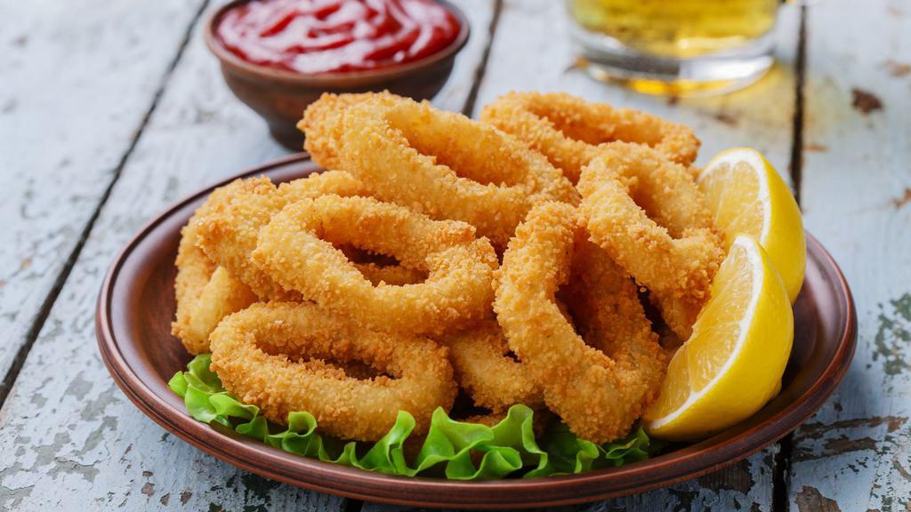 Fried Calamari · Tender calamari rings, lightly battered and fried to golden perfection.