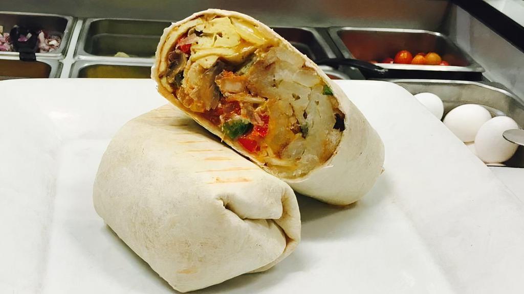 Breakfast Burrito · Omelette with bacon, ham, or sausages mixed cheese home fries wrapped in a flour tortilla.