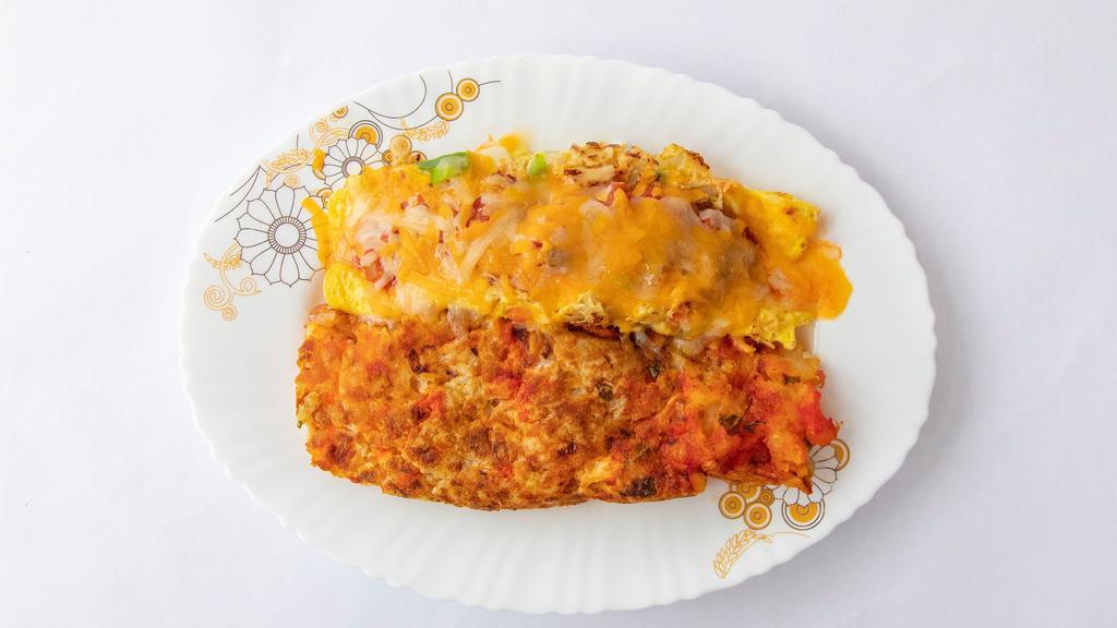 Mexican Omelette · Grilled chicken, onions, peppers, mixed cheese and Spanish salsa.