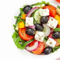Famous Greek Salad · Fresh, crisp lettuce, tomato, cucumber slices, spicy pepperoncini, Greek olives, beets, chic...