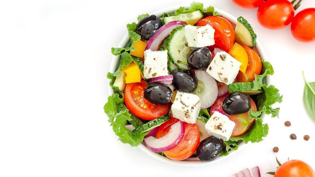 Greek Salad · Greek-style salad with lettuce, feta cheese, tomatoes, olives, and onions.