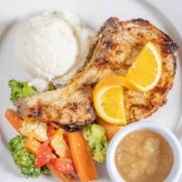 Grilled Marinated Double Cut Pork Chop · served with Mashed Potatoes and House Vegetables.