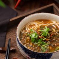 Sour String Beans Noodle In Soup · Contains sour string beans & minced pork, cilantro and hot red peppers. Spicy.