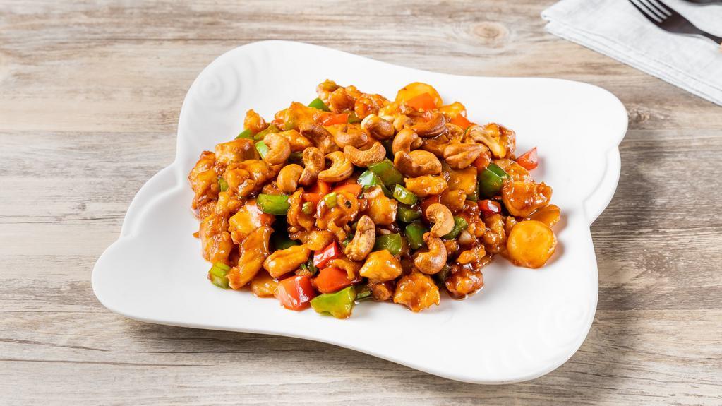 Chicken With Cashew Nuts · Sauteed diced white meat and diced red pepper, water chestnuts, cashew nuts w. Brown sauce.