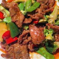 Beef Hunan Style · Sauteed sliced beef and broccoli, snow peas, green pepper, luffa, water chestnut w. Spicy bl...