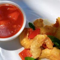 Sweet And Sour Shrimp · Fried prawns and onion, snow peas, pineapple, carrot w. Sweet sour sauce (separate sauce).
