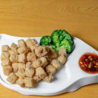 General Tso'S Tofu · Deep fried tofu and a few steamed broccoli w. Sweet sour spicy sauce. Spicy.