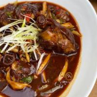 Braised Pig'S Trotters（木桶蹄花） · Pig's trotters with sour string bean, mushrooms and red & green peppers. Every main dish com...