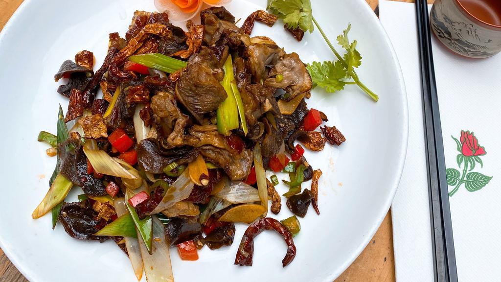Sauteed Preserved Duck With White Peppe（白椒萝卜干腊鸭） · Preserved duck with white pepper, leeks and hot red peppers. Every main dish comes with (1) white rice or (1) brown rice. Spicy.