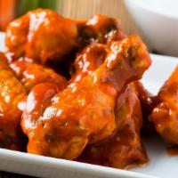 Hot & Spicy Buffalo Wings · Fresh buffalo wings smothered in tangy buffalo sauce and served with creamy bleu cheese dip ...