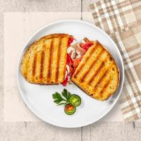 Italian Panini Rising · Grilled chicken, mozzarella cheese, roasted peppers and pesto sauce.