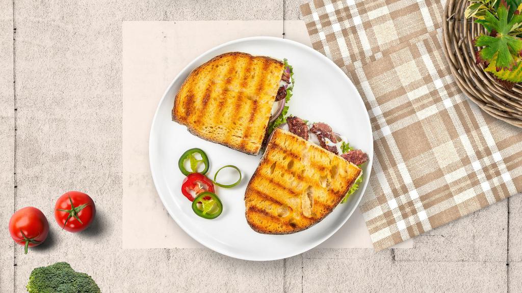 Turk Turf Panini · Sliced turkey, melted cheese, and tomato on your choice of toasted bread.