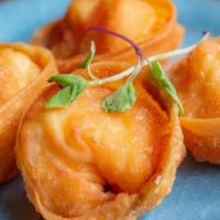 Fried Lobster Dumpling Lunch Special · Lobster and shrimp paste in wonton skin. (Four pieces).