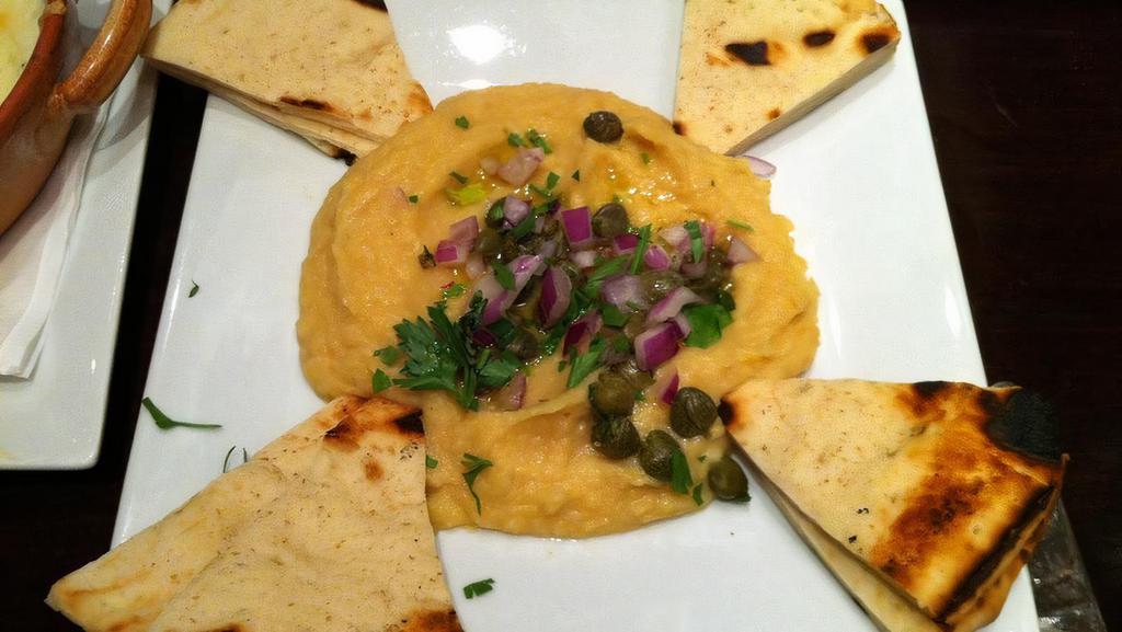 Fava · Yellow split pea puree topped with olive oil, onions and capers.