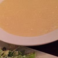 Avgolemono · Egg lemon soup with chicken and rice.