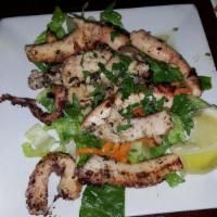 Octapodi · Grilled octopus marinated with herbs and red wine.