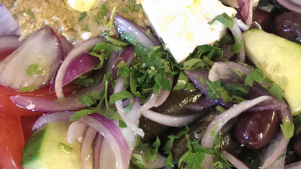 Mesanatolitiki (Middle Eastern) · Dolmades, eggplant spread, cucumbers, feta, red onions, tomato.