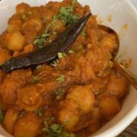 Chana Masala · Chickpeas are slow cooked in a gravy of onion, tomato and special house spice.