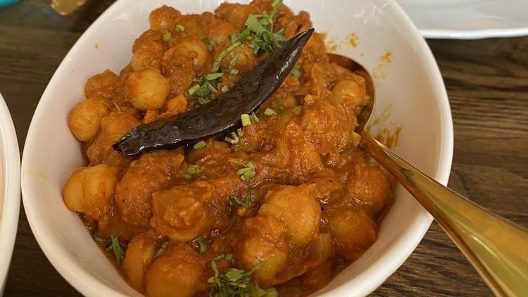 Chana Masala · Chickpeas are slow cooked in a gravy of onion, tomato and special house spice.
