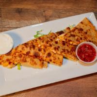 Chipotle Chicken Quesadilla · Grilled chicken, Cheddar Jack, candied bacon, chipotle ranch, salsa.