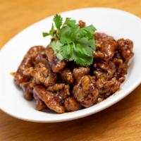Pan Fried Beef · Mild Spicy. Crispy tender beef slices tossed in tangy spicy garlic sauce.