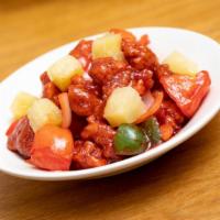 Sweet & Sour Pork · Crispy pork belly, fresh tomatoes, and onions tossed in special sweet and sour sauce. Topped...