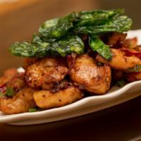 Szechwan Spicy Chicken · Spicy. Tender boneless chicken stir-fried with szechwan spicy peppers and herbs topped with ...